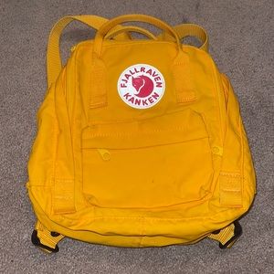 Yellow mini fjallraven kanken backpack